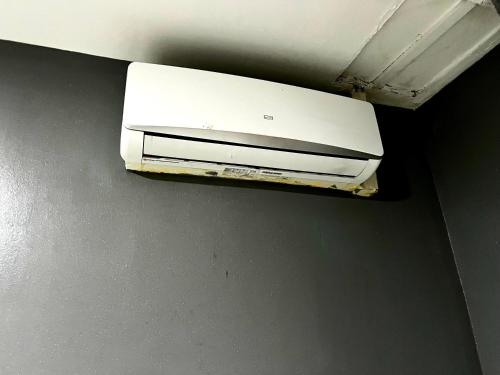 a white appliance sitting on top of a wall at Hostal Gracias in Madrid