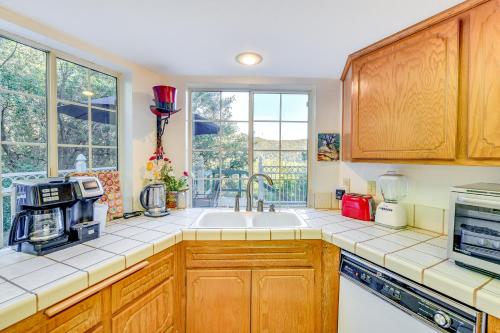a kitchen with a sink and a window at Spacious Idyllwild Home with Mountain Views! in Idyllwild