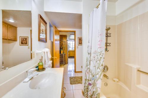 a bathroom with a tub and a sink and a shower at Spacious Idyllwild Home with Mountain Views! in Idyllwild