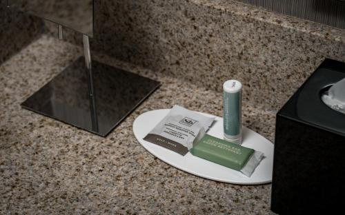 a plate with a toothbrush and toothpaste on a counter at Courtyard by Marriott Winchester Medical Center in Winchester