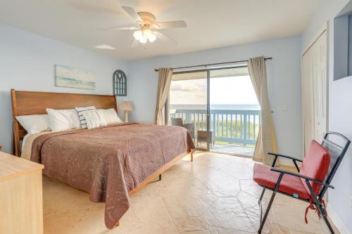 a bedroom with a bed and a view of the ocean at Oceanside Beachfront Fort Pierce Retreat in Fort Pierce