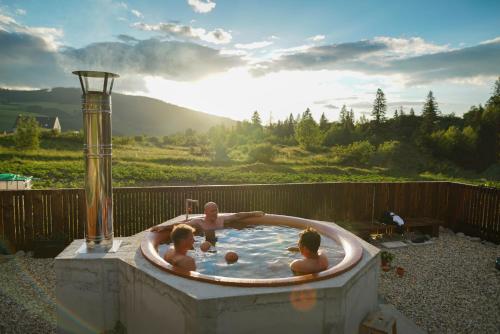 a group of people in a jacuzzi tub at Apartmány Paľovci in Zuberec