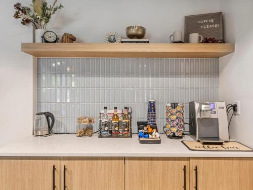 a kitchen counter with a coffee maker on it at Downtown SLC Apartment - King Bed - Gym - Smart TV in Salt Lake City