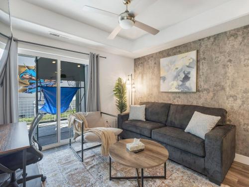 a living room with a couch and a table at City Center Apartment - King Bed - Gym - Smart TV in Salt Lake City
