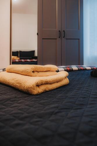 two towels are laying on the floor in a room at Large bedroom, close to Airport and City Centre in Edinburgh