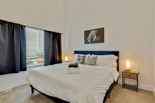 a bedroom with a large bed and a window at Spacious townhouse - Mins to Downtown SLC - Garage in Salt Lake City