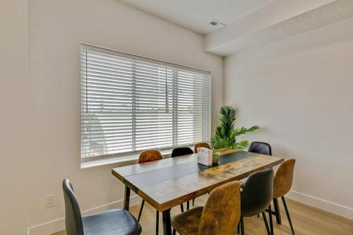 a dining room with a table and chairs and a window at Spacious townhouse - Mins to Downtown SLC - Garage in Salt Lake City