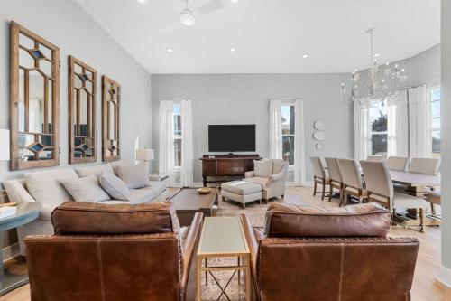 a living room with a couch and a table at Gloria Estate- 2 blocks to Silos in Waco