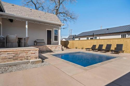 a house with a swimming pool in a yard at Gloria Estate- 2 blocks to Silos in Waco