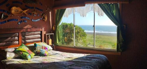 En eller flere senge i et værelse på Frente al mar campo y playa