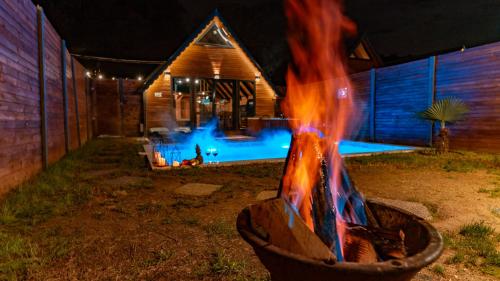 a fire pit in front of a house at night at Sapanca Ravine Bungalow in Sapanca