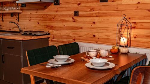 a wooden table with dishes on it in a kitchen at Sapanca Ravine Bungalow in Sapanca