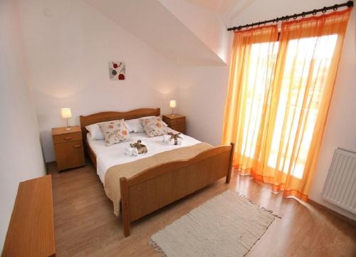 Postel nebo postele na pokoji v ubytování Apartments Antonia