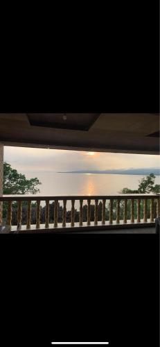 a view from the window of a balcony at KJT Travellers Inn in Guindulman