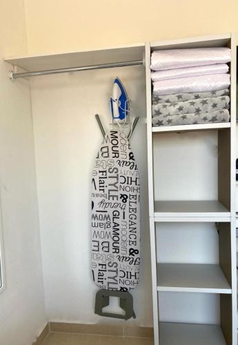 a surfboard hanging on a wall in a closet at CASABONITA II, pie alberca, AirAc in Xochitepec