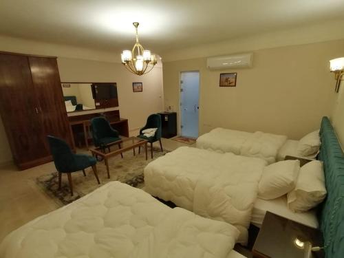 a living room with a couch and a bed at Mirage pyramids view hotel in Cairo