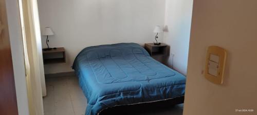 Postel nebo postele na pokoji v ubytování Departamento en Las Grutas 2