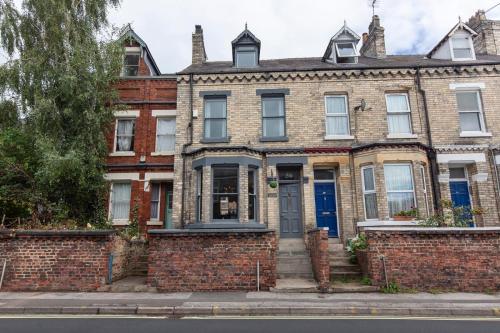 an old brick house with a blue door at The Haven in York