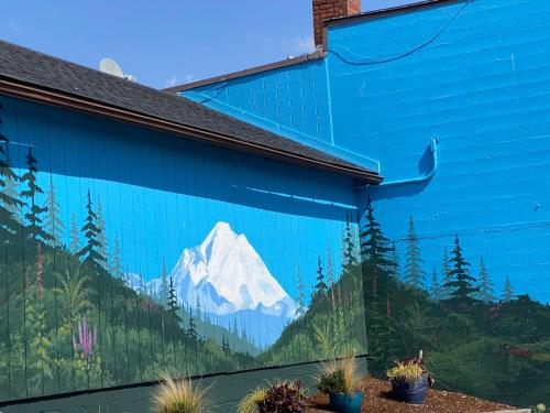 a mural of a mountain on the side of a building at View Harbor Downtown R and R in Oak Harbor