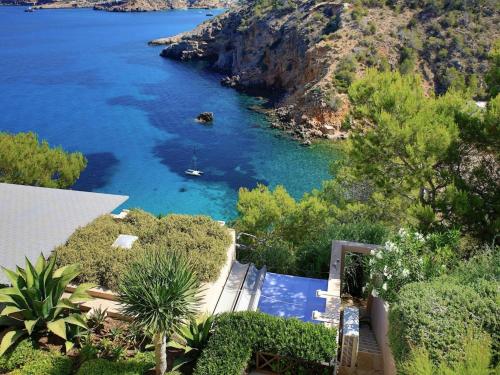 an aerial view of a river with blue water at Villa in Ibiza with Cala Moli Beach Access in Valdepeñas