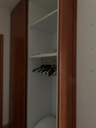 a closet with a bunch of wine bottles in it at Franca's Home in Chianciano Terme
