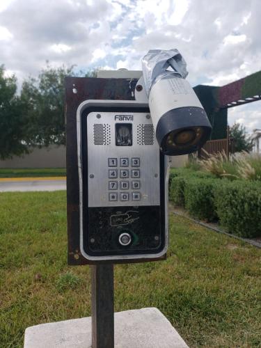 a parking meter with a camera on top of it at 3 bedroom with pool in Reynosa
