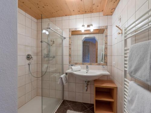a bathroom with a sink and a shower at Haus Hildegard in Gerlos