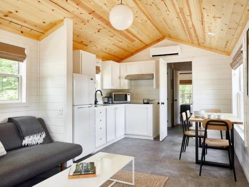 a living room with a couch and a table at AutoCamp Catskills in Saugerties