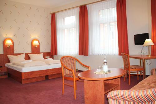 Vuode tai vuoteita majoituspaikassa Hotel Thüringer Hof