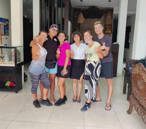 a group of people posing for a picture at B'Lan Riverside Villa in Hoi An