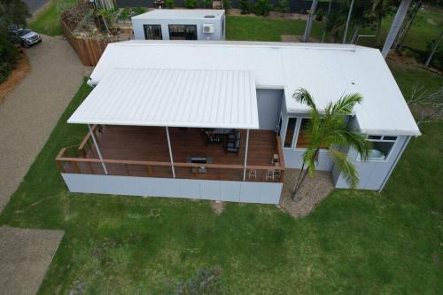 an aerial view of a house with a porch at The Escape Home in Repton
