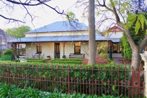 a house with a fence in front of it at Bellisle - 1880's period home in Central Albury in Albury