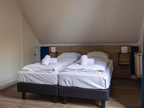 Postel nebo postele na pokoji v ubytování Detached holiday home near Nijmegen