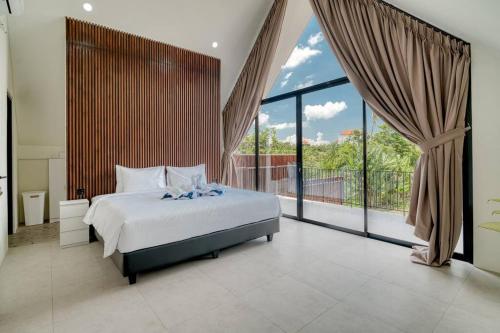 Ένα ή περισσότερα κρεβάτια σε δωμάτιο στο Six Stars Townhouse A2 Brand New 2 Bedroom in Canggu