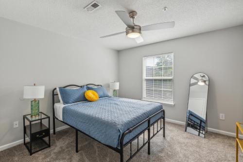 a bedroom with a bed and a ceiling fan at Cb 3508-301 Fayetteville Oasis I Modern, Comfy in Fort Bragg