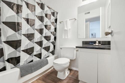 a bathroom with a toilet and a shower at Northcliffe 1107 I Fully Furnished 2 Bedroom 2bth in Winston-Salem