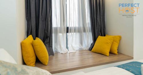 Cama o camas de una habitación en Imperio Residence Seafront by Perfect Host