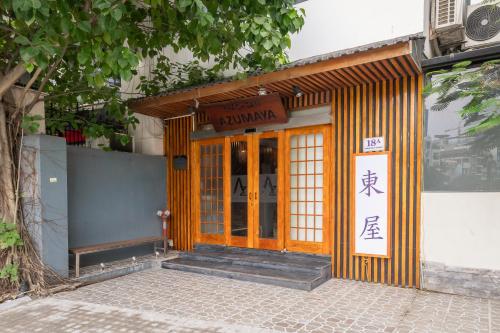 an entrance to a building with a sign on it at Azumaya Hotel Kim Ma 2 in Hanoi