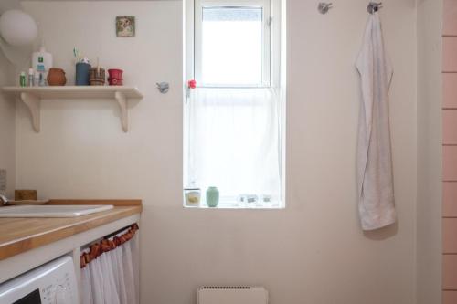 a kitchen with a sink and a window at Awesome Home In Knebel With 2 Bedrooms And Wifi in Knebel