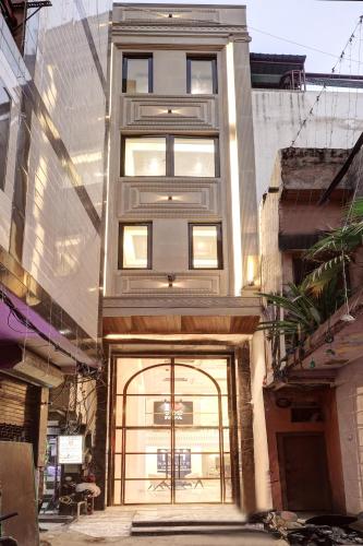a tall building with a door in front of it at Hotel Namaste Hindustan Just a Minute Away From New Delhi Railway Station and Connaught place in New Delhi
