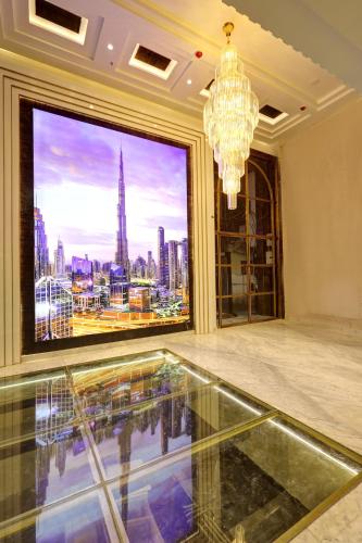 a room with a large window and a chandelier at Hotel Namaste Hindustan Just a Minute Away From New Delhi Railway Station and Connaught place in New Delhi