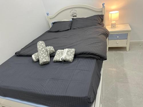 a large bed with two pillows on top of it at Lovely and cosy brandnew room if no one book in other 2 rooms you willl stay by yourself in the whole house in West Hoxton
