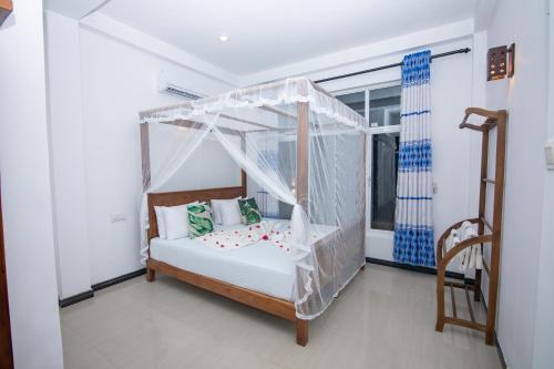Ένα ή περισσότερα κρεβάτια σε δωμάτιο στο JK House Turtle Point