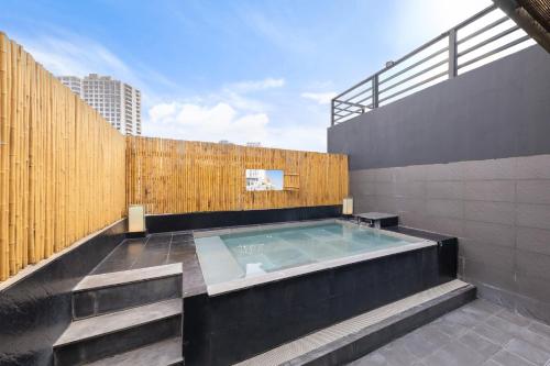 a hot tub on the roof of a building at Azumaya Hotel Kim Ma 2 in Hanoi