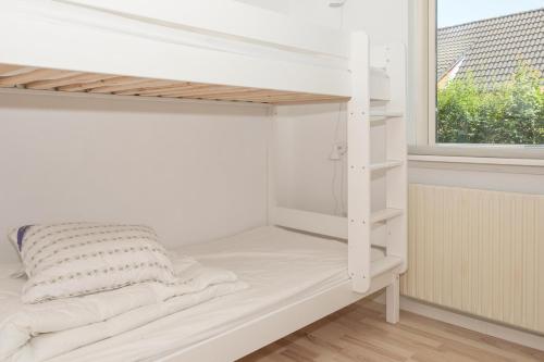 a white bunk bed in a room with a window at Beautiful Home In Knebel With 3 Bedrooms in Ebeltoft