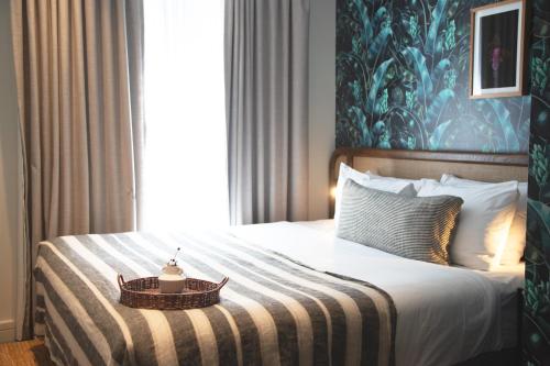 a bedroom with a bed with a table on it at 202 Elizabeth in Sydney