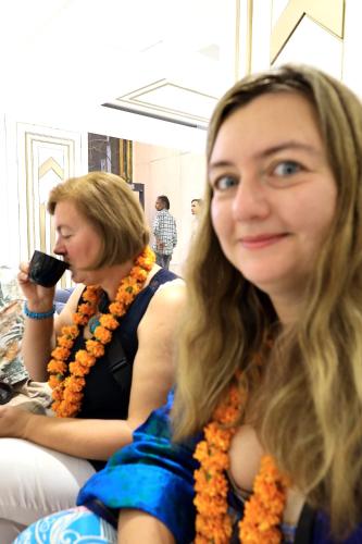 two women sitting on a couch looking at the camera at Hotel Namaste Hindustan Just a Minute Away From New Delhi Railway Station and Connaught place in New Delhi