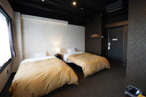 Postel nebo postele na pokoji v ubytování Hotel Chino