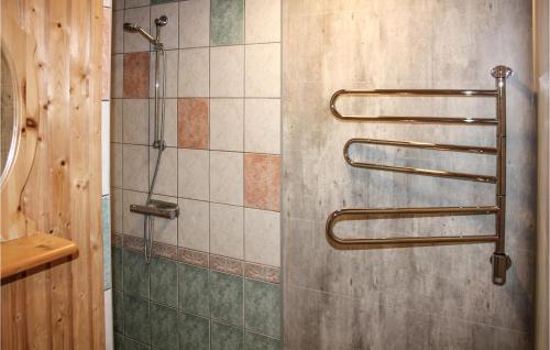 a shower in a bathroom with a glass door at Lovely Home In Köpingsvik With Sauna in Grönskog