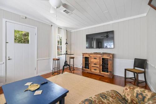 a living room with a table and a couch at Cloverdale Cottage in Montgomery